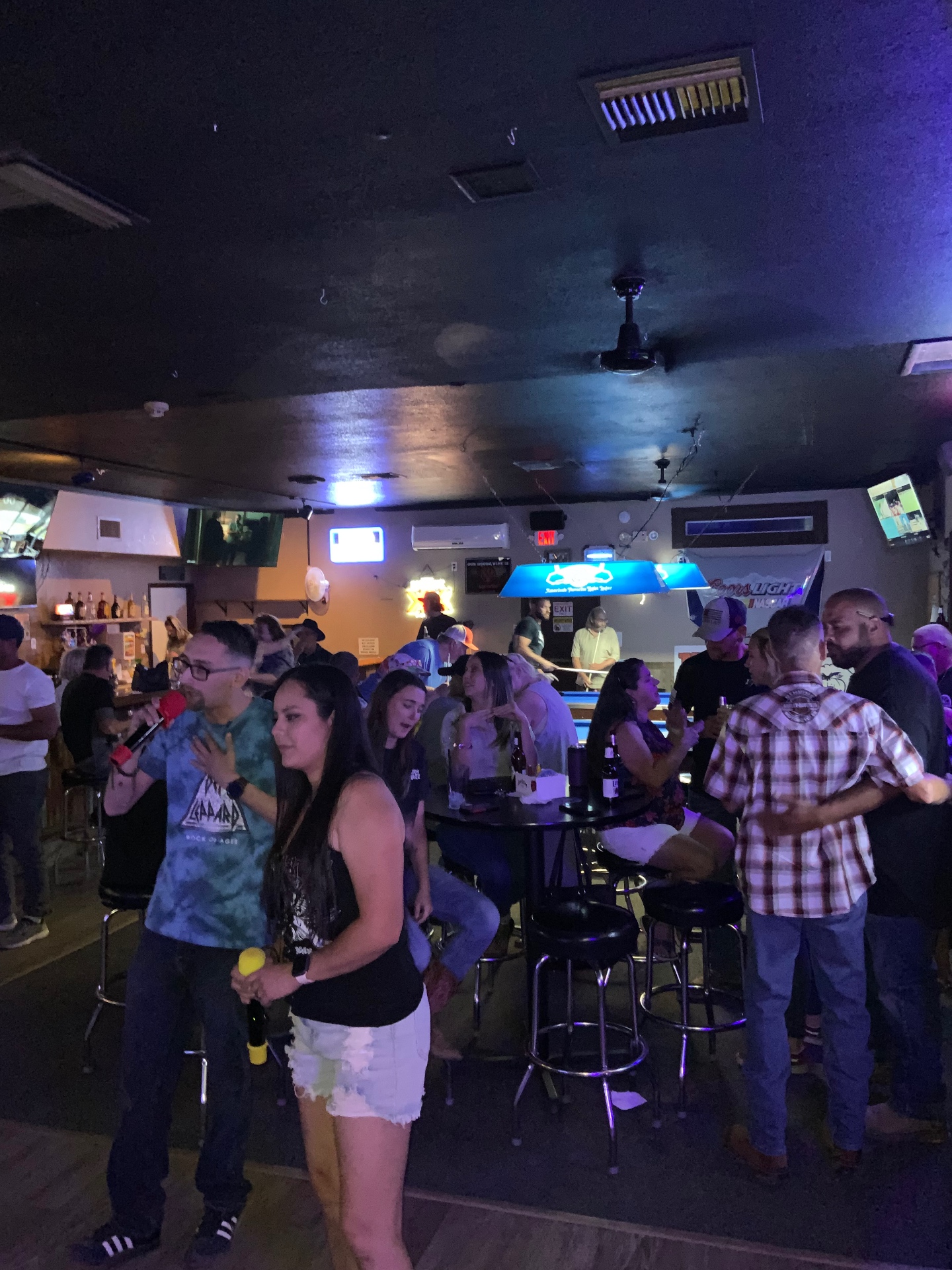 Guests singing at a Leather & Lace hosted karaoke night in Las Vegas
